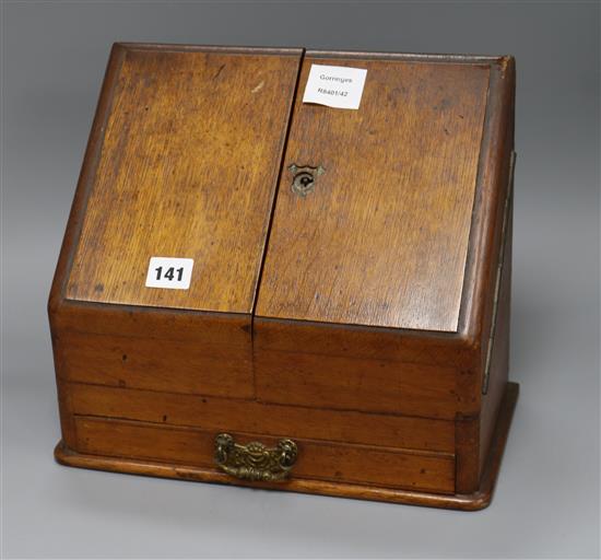 An Edwardian oak stationery box